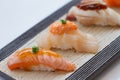 Closed-Up Torched Salmoni Sushi, Hotate Scallop Sushi and Torched Hamachi Yellowtail Fish Sushi. Royalty Free Stock Photo