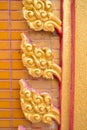 Closed up traditional Thai Sculpture and pattern in wall Royalty Free Stock Photo