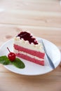 Closed up white red strawberry cake with cherry and green mint leaves. Royalty Free Stock Photo