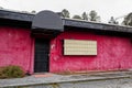 A closed urban club with bars on the door and blank sign Royalty Free Stock Photo