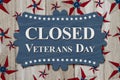 Closed Veterans Day sign with star flag