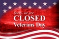 Closed Veterans Day sign with USA flag