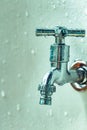 Closed wet valve faucet vertical photo close up plumbing drinking water Royalty Free Stock Photo