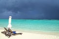 Closed white Beach Umbrella And chairs. Peaceful seascape. Abstract vacation, holidays and Summer image. rain