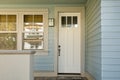 Closed white door of a home