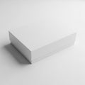 A closed white rectangular gift box with a lid casting a soft shadow on a white surface present Royalty Free Stock Photo