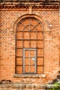 Closed windows in old orange old brick wall Royalty Free Stock Photo