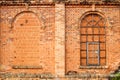 Closed windows in old orange old brick wall Royalty Free Stock Photo