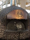 Closed Wood-burning Oven with Copper Sign