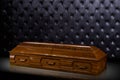 Closed wooden brown sarcophagus isolated on gray luxury background. casket, coffin on royal background. Royalty Free Stock Photo