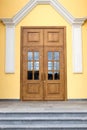 Closed wooden door with glass inserts. Royalty Free Stock Photo