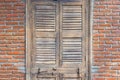 Closed wooden door with red bricks wall in old vintage house. Abstract background. Old fashion, retro construction style Royalty Free Stock Photo