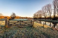 Closed wooden gate in a Dutch winter landscape