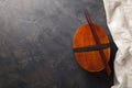 Closed wooden Japanese lunchbox with chopsticks, on an dark stone table. Top view with copy space