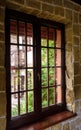 Closed wooden plastic vinyl window in old interior