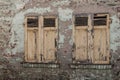 a closed wooden shutter on the wall of a house Royalty Free Stock Photo