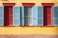 closed wooden shutters on a brightly painted house