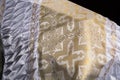 Closed wooden white coffin covered with white ritual blanket isolated close-up.