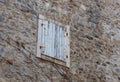 Closed wooden window in the day. Wall in the old city, Budva,