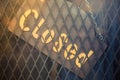 Closed word, sign on vintage board of the jeans shop