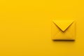 A closed yellow envelope on a vibrant yellow background, creating a bold and monochromatic visual effect. Royalty Free Stock Photo