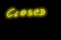 Closed yellow neon glowing text handwriting