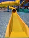 Closed yellow water slide on the background of the water park