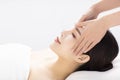 Closed young woman face and head massage in spa Royalty Free Stock Photo