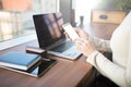 Closely business person holding modern white mobile phone with empty mock-up copy space screen