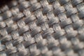 Closely gray polyamide fabric, small gap between fibers, neat weave, large glossy fiber, high magnification, super macro