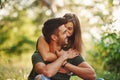 Closeness of people. Beautiful young couple have a good time in the forest at daytime