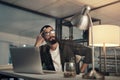 The closer to finishing the less I seem to focus. a young businessman looking uncertain while working late at night in a