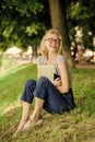 Closer to nature. Nature inspiring environment. Girl carefree student worker laptop relaxing outdoors sit green grass Royalty Free Stock Photo