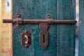 Closer view of a brown rusty iron latch on an old gate Royalty Free Stock Photo