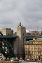 Closer view at the historical buildings at the river tyne with a hidden steeple under a cloudy sky in newcastle north east england