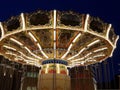 Closest picture of a wave swinger with bright lights at sunset at the Jakarta theme park