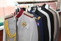 Closet. hanger with mens suits, tuxedos, jackets officer for carnival themed party