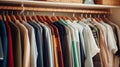 A closet with many different colored shirts hanging on hangers, AI Royalty Free Stock Photo