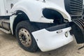 Closeup of abandoned crashed lorry after road accident on a car dump, decay on the front bumper of Royalty Free Stock Photo