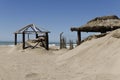 Closeup of abandoned tents on the beach during the out of season period Royalty Free Stock Photo