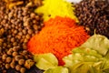 Closeup from above different piles of colorful spices, beautiful rustic setting, spice and herbal concept Royalty Free Stock Photo