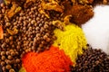 Closeup from above different piles of colorful spices, beautiful rustic setting, spice and herbal concept Royalty Free Stock Photo
