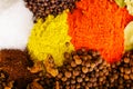 Closeup from above different piles of colorful spices, beautiful rustic setting, spice and herbal concept Royalty Free Stock Photo