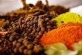 Closeup from above different piles of colorful spices, beautiful rustic setting, spice and herbal concept