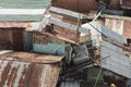 Closeup above view of rusty sheet metal roofing of slum houses of a squatter area. Royalty Free Stock Photo