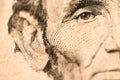 Closeup of Abraham Lincoln Face on Five Dollar Bill Royalty Free Stock Photo