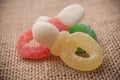acidulous candies on hessian background Royalty Free Stock Photo