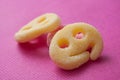 Acidulous candies in shaped smiley on pink background Royalty Free Stock Photo