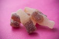 Acidulous cola candies on pink background Royalty Free Stock Photo