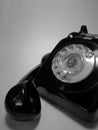 A vintage and antique telephone with white background.